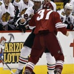 Phoenix Coyotes' Raffi Torres (37) fights with Chicago Blackhawks' Jamal Mayers (22) during the first period in an NHL hockey game Thursday, Feb. 7, 2013, in Glendale, Ariz.(AP Photo/Ross D. Franklin)