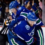 Vancouver Canucks' Ryan Kesler, right, and Mason Raymond celebrate Kesler's goal against the Phoenix Coyotes during the first period of an NHL hockey game in Vancouver, British Columbia, on Monday April 8, 2013. (AP Photo/The Canadian Press, Darryl Dyck)
