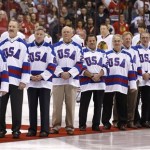 Members of the gold medal 1980 "Miracle on Ice" U.S. Olympic hockey team are honored prior to an NHL hockey game between the Chicago Blackhawks and the Phoenix Coyotes, Friday Feb. 7, 2014, in Glendale, Ariz. (AP Photo/Ross D. Franklin)