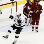 Los Angeles Kings' Anze Kopitar (11), of Slovenia, celebrates his goal as Phoenix Coyotes' Ray Whitney, right, and goalie Mike Smith look away in the first period during Game 5 of the NHL hockey Stanley Cup Western Conference finals, Tuesday, May 22, 2012, in Glendale, Ariz. (AP Photo/Ross D. Franklin)