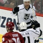 Los Angeles Kings center Jeff Carter (77) celebrates after scoring against the Phoenix Coyotes in the second period during an NHL hockey game Saturday, Jan. 26, 2013, in Glendale, Ariz. (AP Photo/Rick Scuteri)
