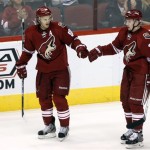Phoenix Coyotes center Antoine Vermette (50) celebrates with Lauri Korpikoski (28) after scoring a third period goal against the Toronto Maple Leafs during an NHL hockey game, Monday, Jan. 20, 2014, in Glendale, Ariz. (AP Photo/Rick Scuteri)