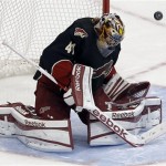 Phoenix Coyotes goalie Mike Smith deflects a shot on goal against the Minnesota Wild during the third period of an NHL hockey game, Monday, Feb. 4, 2013, in Glendale, Ariz. The Coyotes won 2-1. (AP Photo/Matt York)