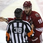 Phoenix Coyotes right wing Shane Doan (19) talks to referee Francois Laurent in the second period during an NHL hockey game against the Los Angeles Kings on Saturday, Jan. 26, 2013, in Glendale, Ariz. (AP Photo/Rick Scuteri)
