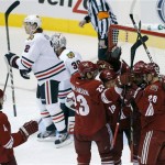 Phoenix Coyotes' Zbynek Michalek (4), of the Czech Republic, Oliver Ekman-Larsson (23), of Sweden, and Lauri Korpikoski (28), of Finland, celebrate a goal by David Moss (18) as Chicago Blackhawks' Duncan Keith (2) and Ray Emery (30) look away during the first period of an NHL hockey game, Sunday, Jan. 20, 2013, in Glendale, Ariz. (AP Photo/Matt York)