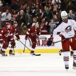 Columbus Blue Jackets' Nick Foligno, right, skates away as the Phoenix Coyotes celebrate a goal by Steve Sullivan during the second period in an NHL hockey game, Wednesday, Jan. 23, 2013, in Glendale, Ariz. (AP Photo/Ross D. Franklin)