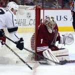 Phoenix Coyotes goalie Jason LaBarbera (1) makes a save on Los Angeles Kings center Jeff Carter (77) in the first period during an NHL hockey game Saturday, Jan. 26, 2013, in Glendale, Ariz. (AP Photo/Rick Scuteri)
