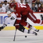 Phoenix Coyotes center Martin Hanzal (11) collides with Los Angeles Kings defenseman Slava Voynov during the first period of Game 2 of the NHL hockey Stanley Cup Western Conference finals, Tuesday, May 15, 2012, in Glendale, Ariz. (AP Photo/Matt York)