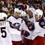 Columbus Blue Jackets' Fedor Tyutin (51), of Russia, celebrates his goal against the Phoenix Coyotes with teammates Derek Dorsett (15), R.J. Umberger (18), Derick Brassard (16) and Nikita Nikitin, of Russia, during the second period in an NHL hockey game, Wednesday, Jan. 23, 2013, in Glendale, Ariz. (AP Photo/Ross D. Franklin)