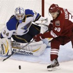 Phoenix Coyotes' Antoine Vermette (50) tries to redirect the puck in front of St. Louis Blues' Jake Allen (34) in the second period of an NHL hockey game, Thursday, March 7, 2013, in Glendale, Ariz. (AP Photo/Ross D. Franklin)