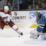 San Jose Sharks goalie Antti Niemi, of Finland, right, stops a shot attempt by Phoenix Coyotes right wing Mikkel Boedker, of Denmark, during the second period of an NHL hockey game in San Jose, Calif., Saturday, Feb. 9, 2013. (AP Photo/Marcio Jose Sanchez)
