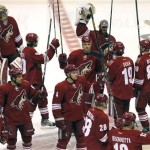 The Phoenix Coyotes take the ice to greet fans prior to an NHL hockey game against the Chicago Blackhawks, Sunday, Jan. 20, 2013, in Glendale, Ariz. (AP Photo/Matt York)