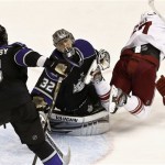 Los Angeles Kings' Jonathan Quick (32) reacts to a goal by Phoenix Coyotes' Raffi Torres, right, as Kings' Keaton Ellerby (5) skates nearby during the second period of an NHL hockey game Tuesday, March 12, 2013, in Glendale, Ariz. (AP Photo/Ross D. Franklin)