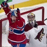 Montreal Canadiens' Brendan Gallagher celebrates a goal by Andrei Markov against Phoenix Coyotes goalie Mike Smith during the third period of an NHL hockey game Tuesday, Dec. 17, 2013, in Montreal. Montreal won 3-1. (AP Photo/The Canadian Press, Paul Chiasson)