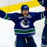 Vancouver Canucks' Kevin Bieksa celebrates his winning goal against the Phoenix Coyotes during the third period of an NHL hockey game in Vancouver, British Columbia, on Sunday, Jan. 26, 2014. (AP Photo/The Canadian Press, Darryl Dyck)