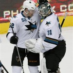 
San Jose Sharks goalie Antti Niemi (31) celebrates with Matt Irwin (52) after defeating the Phoenix Coyotes in an overtime shoot-out 4-3, during an NHL hockey game on Friday, Dec. 27, 2013, in Glendale, Ariz. (AP Photo/Rick Scuteri)