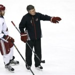 Phoenix Coyotes head coach Dave Tippett, right, talks with Alex Bolduc during an NHL hockey practice, Tuesday, Jan. 15, 2013, in Glendale, Ariz. (AP Photo/Ross D. Franklin)