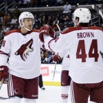 Phoenix Coyotes' Rob Klinkhammer (36) celebrates his goal with teammate Chris Brown (44) against the Los Angeles Kings during the first period of an NHL preseason hockey game, Sunday, Sept. 15, 2013, in Los Angeles. (AP Photo/Kevork Djansezian)