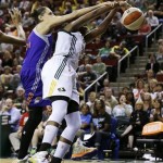 Phoenix Mercury's Diana Taurasi, left, fouls Seattle Storm's Camille Little late in the second half of a WNBA basketball game Thursday, Aug. 1, 2013, in Seattle. The Seattle Storm won 88-79. (AP Photo/Elaine Thompson)