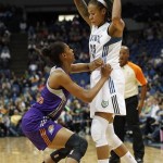 Minnesota Lynx Seimone Augustus (33) protects the ball from Phoenix Mercury guard Briana Gilbreath (15) in the first half of a WNBA basketball game, Thursday, June 6, 2013, in Minneapolis. (AP Photo/Stacy Bengs)