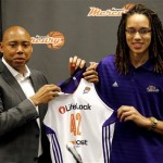 Phoenix Mercury's Brittney Griner, the No. 1 overall pick the WNBA draft, holds a team jersey with head coach Corey Gaines during a news conference Saturday, April 20, 2013, in Phoenix. (AP Photo/Matt York)
