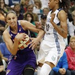 Phoenix Mercury guard Diana Taurasi (3) protects the ball from Minnesota Lynx guard Seimone Augustus (33) in the second half of a WNBA basketball game, Thursday, June 6, 2013, in Minneapolis. The Lynx won 99-79. (AP Photo/Stacy Bengs)