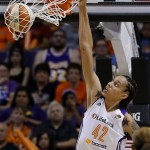 Phoenix Mercury's Brittney Griner gets her first dunk against the Chicago Sky in the second half during a WNBA basketball game on Monday, May 27, 2013, in Phoenix. The Sky defeated the Mercury 102-80. (AP Photo/Ross D. Franklin)