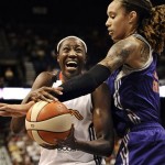 Connecticut Sun's Tina Charles, right, is fouled by Phoenix Mercury's Brittney Griner during the first half of a WNBA basketball game in Uncasville, Conn., Saturday, June 29, 2013. (AP Photo/Jessica Hill)

