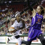 Seattle Storm's Camille Little, left, drives the lane as Phoenix Mercury's Brittney Griner defends in the second half of a WNBA basketball game Thursday, Aug. 1, 2013, in Seattle. The Seattle Storm won 88-79. (AP Photo/Elaine Thompson)