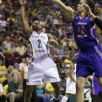 Seattle Storm's Temeka Johnson (2) has her shot blocked by Phoenix Mercury's Brittney Griner in the first half of a WNBA basketball game, Sunday, June 2, 2013, in Seattle. (AP Photo/Elaine Thompson)