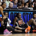 East's Cappie Pondexter, of the New York Liberty; Epiphanny Prince, of the Chicago Sky; Tina Charles, of the Connecticut Sun; and Angel McCoughtry, of the Atlanta Dream, wait to be called into play during the first half of the WNBA All-Star basketball game in Uncasville, Conn., Saturday, July 27, 2013. (AP Photo/Jessica Hill)
