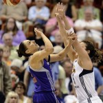 Connecticut Sun's Kelsey Griffin, right, stops a drive by Phoenix Mercury's Diana Taurasi, left, during the first half of a WNBA basketball game in Uncasville, Conn., Saturday, June 29, 2013. (AP Photo/Jessica Hill)
