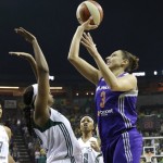 Phoenix Mercury's Diana Taurasi, right, shoots over Seattle Storm's Camille Little in the first half of a WNBA basketball game Sunday, June 2, 2013, in Seattle. (AP Photo/Elaine Thompson)
