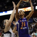 Phoenix Mercury's DeWanna Bonner, right, is guarded by Connecticut Sun's Kelly Faris, left, during the second half of a WNBA basketball game in Uncasville, Conn., Saturday, June 29, 2013. Phoenix won 89-70. (AP Photo/Jessica Hill)
