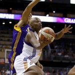 Phoenix Mercury's Charde Houston, front, gets past Los Angeles Sparks' Candace Parker for a shot during the first half in a WNBA basketball game on Friday, June 14, 2013, in Phoenix. (AP Photo/Ross D. Franklin)
