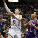 Minnesota Lynx guard Lindsay Whalen (13) goes up for the basket against Phoenix Mercury guard Diana Taurasi (3) in the first half of a WNBA basketball game, Thursday, June 6, 2013, in Minneapolis. (AP Photo/Stacy Bengs)