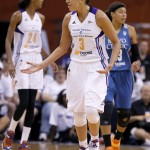 Phoenix Mercury's Diana Taurasi (3) argues with a referee over a dribble carry call against her as Mercury's DeWanna Bonner (24) and Minnesota Lynx's Seimone Augustus, right, look for the ball during the first half in Game 1 of the WNBA Western Conference Finals Friday, Aug. 29, 2014, in Phoenix. (AP Photo/Ross D. Franklin)