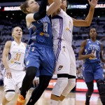 Minnesota Lynx's Lindsay Whalen (13) tries to get off a shot as Phoenix Mercury's Candice Dupree (4) defends while Mercury's Erin Phillips (31), of Australia, and Lynx's Devereaux Peters, right, look on during the first half in Game 1 of the WNBA Western Conference Finals Friday, Aug. 29, 2014, in Phoenix. (AP Photo/Ross D. Franklin)