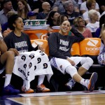 From left: Phoenix Mercury's Brittney Griner, Candice Dupree, Diana Taurasi and Penny Taylor watch their teammates compete against the Chicago Sky during the second half of Game 2 of the WNBA basketball finals, Tuesday, Sept. 9, 2014, in Phoenix. The Mercury won 97-68 to take a 2-0 series lead. (AP Photo/Matt York)