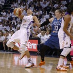 Phoenix Mercury's Diana Taurasi (3) gets fouled by Minnesota Lynx's Lindsay Whalen (13) as Mercury's Candice Dupree, right, sets a pick during the second half in Game 1 of the WNBA Western Conference finals Friday, Aug. 29, 2014, in Phoenix. The Mercury defeated the Lynx 85-71. (AP Photo/Ross D. Franklin)