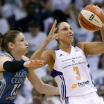 Phoenix Mercury's Diana Taurasi (3) tries to keep the ball away from Minnesota Lynx's Lindsay Whalen, left, during the first half in Game 1 of the WNBA Western Conference Finals basketball game, Friday, Aug. 29, 2014, in Phoenix. (AP Photo/Ross D. Franklin)