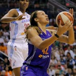 West's Brittney Griner, of the Phoenix Mercury, drives past East's Angel McCoughtry, of the Atlanta Dream, during the first half the WNBA All-Star basketball game, Saturday, July 19, 2014, in Phoenix. (AP Photo/Matt York)