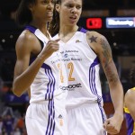 Phoenix Mercury's Brittney Griner, right, celebrates a blocked shot against the Los Angeles Sparks with teammate DeWanna Bonner, left, during the first half in Game 1 of the WNBA basketball Western Conference semifinals Friday, Aug. 22, 2014, in Phoenix. (AP Photo/Ross D. Franklin)
