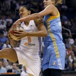 Phoenix Mercury forward Mistie Bass (8) rebounds over Chicago Sky forward Elena Delle Donne during the first half of Game 2 of the WNBA basketball finals, Tuesday, Sept. 9, 2014, in Phoenix. (AP Photo/Matt York)