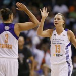 Phoenix Mercury forward Penny Taylor (13) high fives Diana Taurasi (3) during the second half of Game 2 of the WNBA basketball finals against the Chicago Sky, Tuesday, Sept. 9, 2014, in Phoenix. (AP Photo/Matt York)