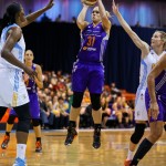 Phoenix Mercury's Erin Phillips shoots against against Chicago Sky's Sylvia Fowles and Allie Quigley during the first half of Game 3 of the WNBA Finals basketball series, Friday, Sept. 12, 2014, in Chicago. (AP Photo/Kamil Krzaczynski)