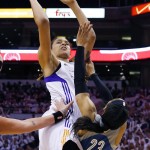 Phoenix Mercury's Brittney Griner shoots over Minnesota Lynx's Maya Moore (23) during the second half in Game 1 of the WNBA Western Conference finals Friday, Aug. 29, 2014, in Phoenix. The Mercury defeated the Lynx 85-71. (AP Photo/Ross D. Franklin)