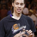 Phoenix Mercury's Brittney Griner smiles as she receives the WNBA defensive player of the year award prior to Game 1 of the WNBA basketball Western Conference semifinals against the Los Angeles Sparks, Friday, Aug. 22, 2014, in Phoenix. (AP Photo/Ross D. Franklin)