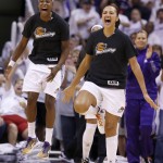 Phoenix Mercury's Mistie Bass, right, and Eshaya Murphy, left, celebrate a Mercury score against the Minnesota Lynx during the second half in Game 1 of the WNBA Western Conference finals Friday, Aug. 29, 2014, in Phoenix. The Mercury defeated the Lynx 85-71. (AP Photo/Ross D. Franklin)