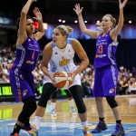 Chicago Sky's Elena Delle Donne, center, looks to pass Phoenix Mercury forward Candice Dupree (4) and forward Penny Taylor (13) during the second half of Game 3 of the WNBA basketball finals, Friday, Sept. 12, 2014, in Chicago. The Mercury won 87-82. (AP Photo/Kamil Krzaczynski)